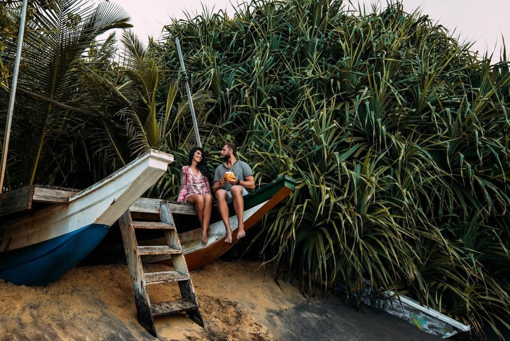 Couple In Love On The Seaside Drinking Coconut Co